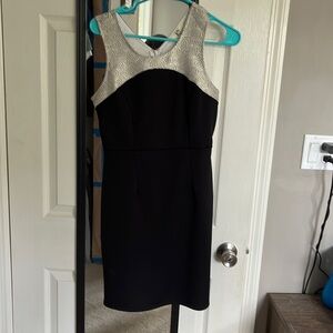 Black dress with white/gold design and keyhole opening in the back